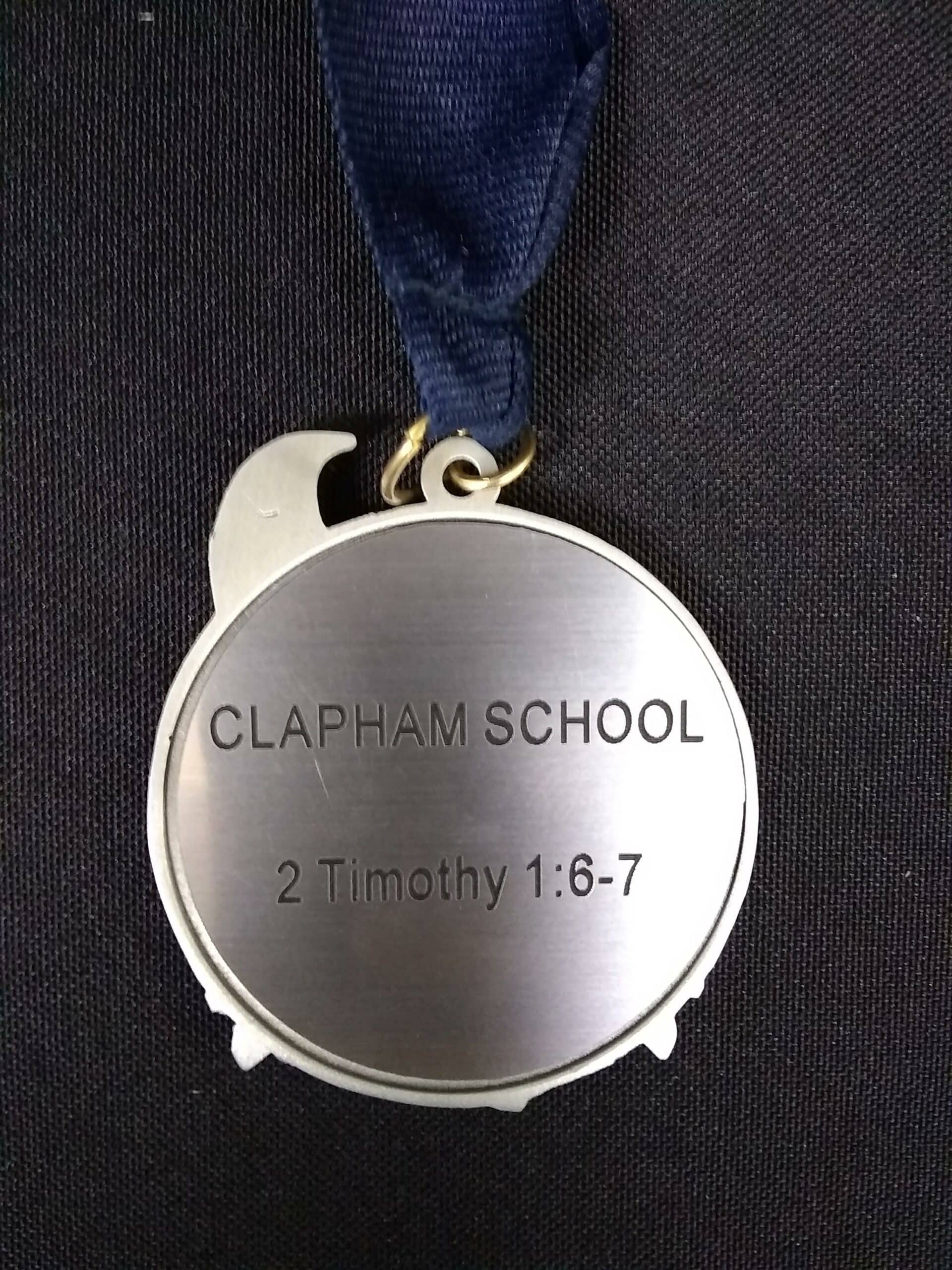 he Class 5 medal with an inscription of 2 Timothy 1:6-7